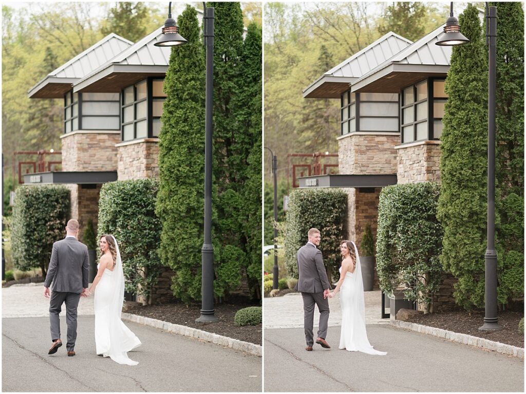 Bride and groom walking away in front of the venue the Stone house at Stirling ridge