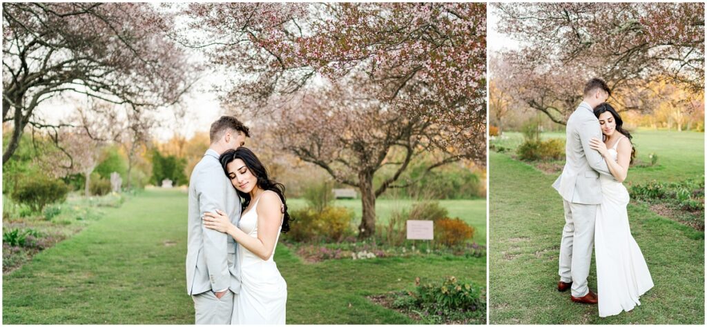a couple hugging with their eyes closed at the Skyland's Manor Crabapple Allée