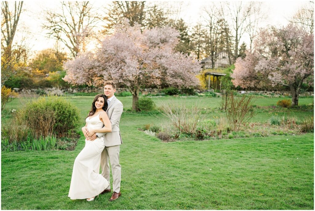 a couple posing for photo at the Skyland's Manor Crabapple Allée